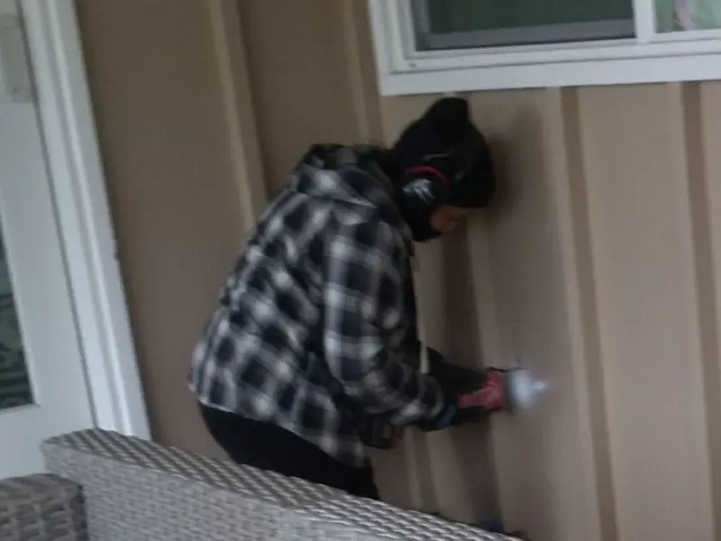 Professional electrician installing an exterior outlet in Bethany