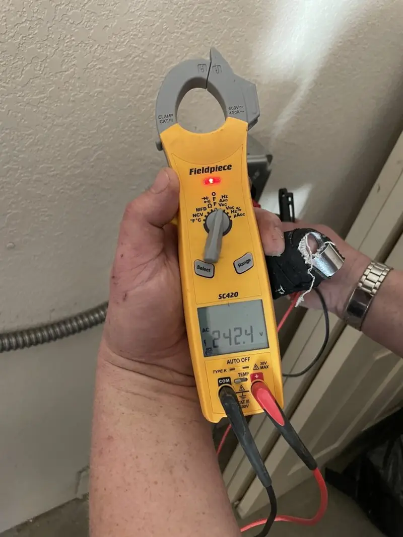 Voltage testing with clamp meter during Electrical Installation Services in Bethany